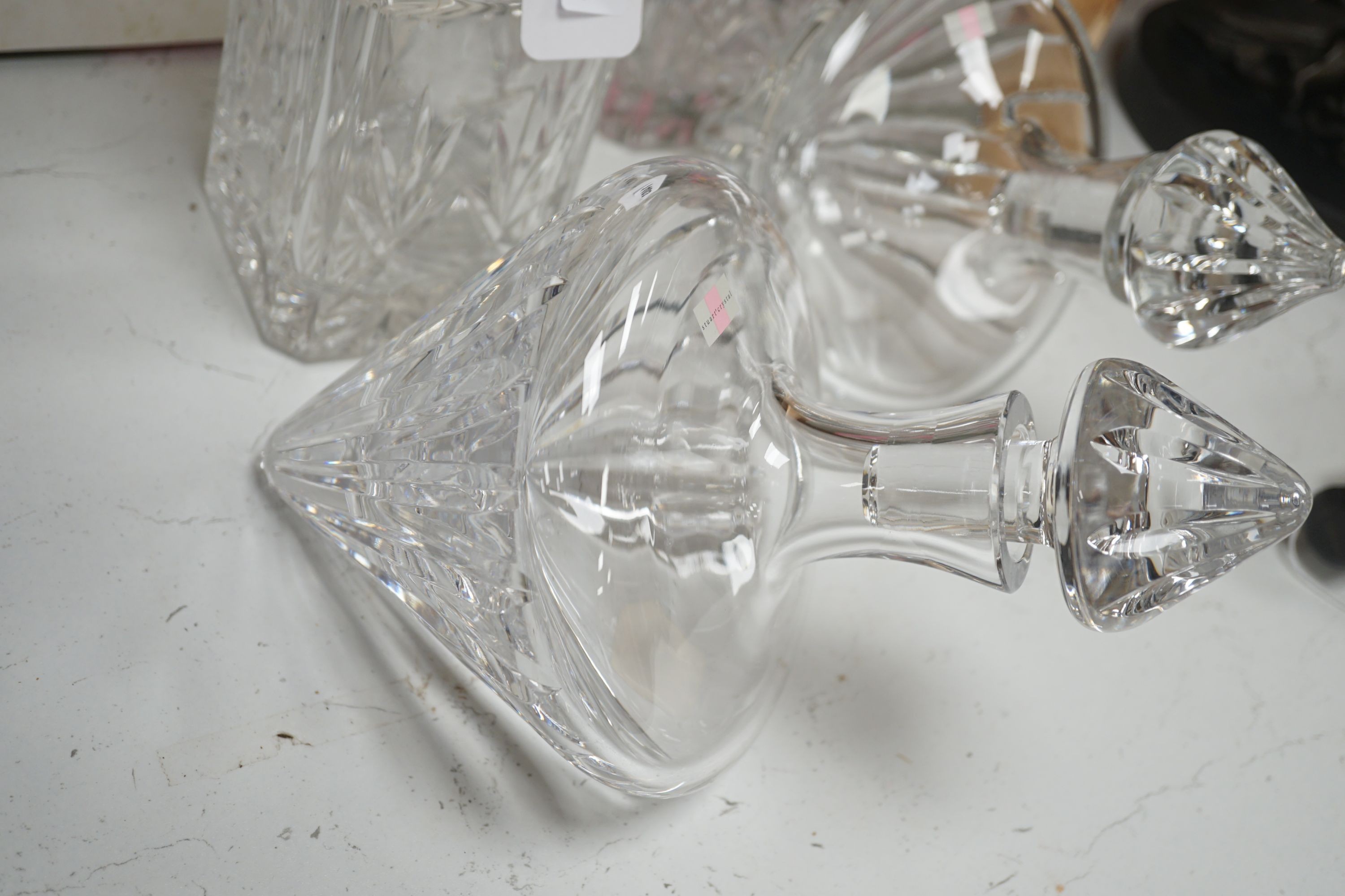 A pair of spirit decanters and a boxed pair of novelty Stuart 'rest' decanters.